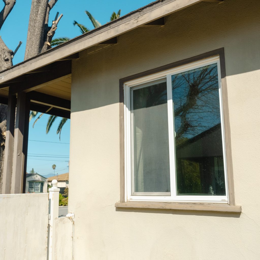 Angled front view with bag zipped and handles upright.